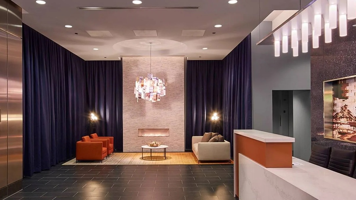 Grand lobby and reception area featuring modern design, comfortable seating, and stylish lighting at Marquee at Block 37 in Chicago