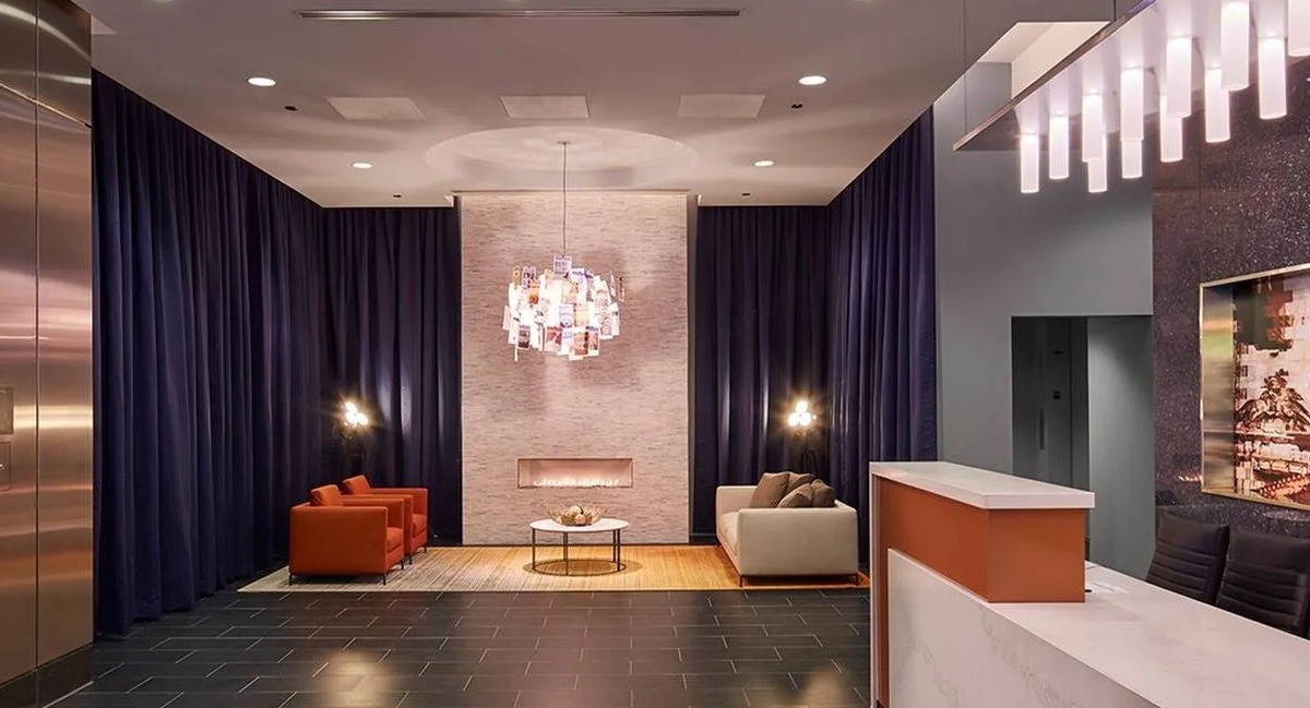 Grand lobby and reception area featuring modern design, comfortable seating, and stylish lighting at Marquee at Block 37 in Chicago