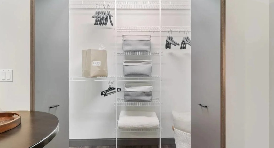 Organized bedroom closet with shelving, hangers, and ample space for clothes and belongings at Millennium on LaSalle in Chicago