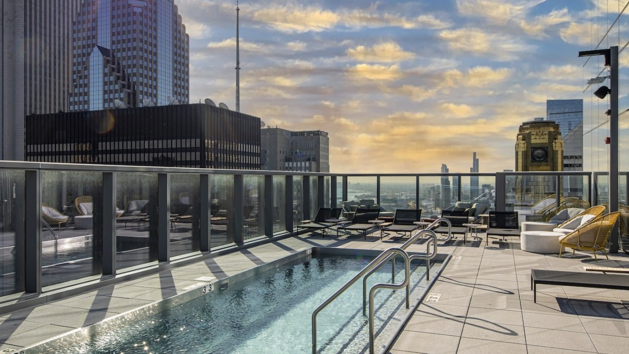 Rooftop pool deck at Millie on Michigan in Chicago with stunning city views during a beautiful sunset