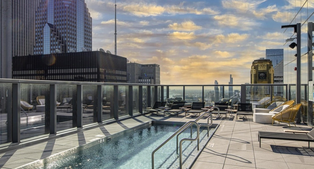Rooftop pool deck at Millie on Michigan in Chicago with stunning city views during a beautiful sunset