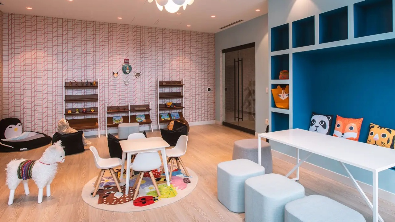 Vibrant children's playroom at NEMA Chicago, featuring colorful furniture, playful decor, and engaging activities for young residents