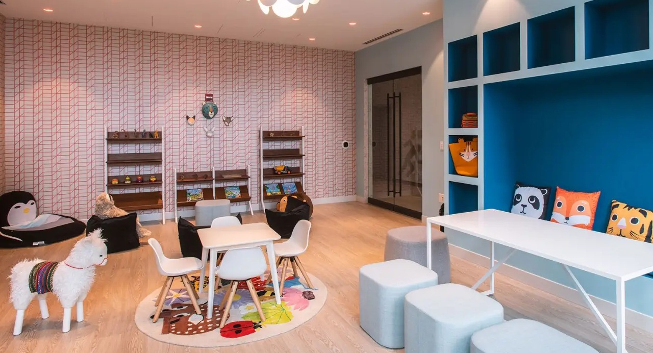 Vibrant children's playroom at NEMA Chicago, featuring colorful furniture, playful decor, and engaging activities for young residents