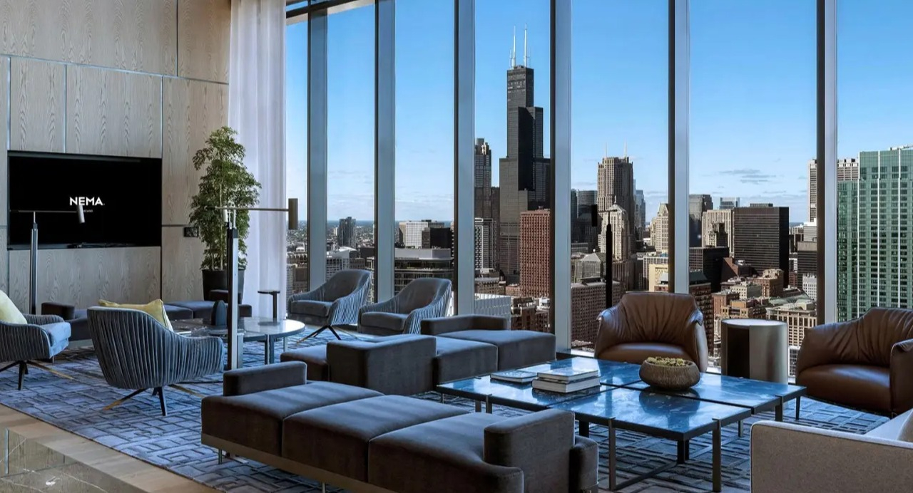 Luxurious skyline lounge at NEMA Chicago, featuring plush seating areas, modern design, and breathtaking panoramic views of the Chicago skyline