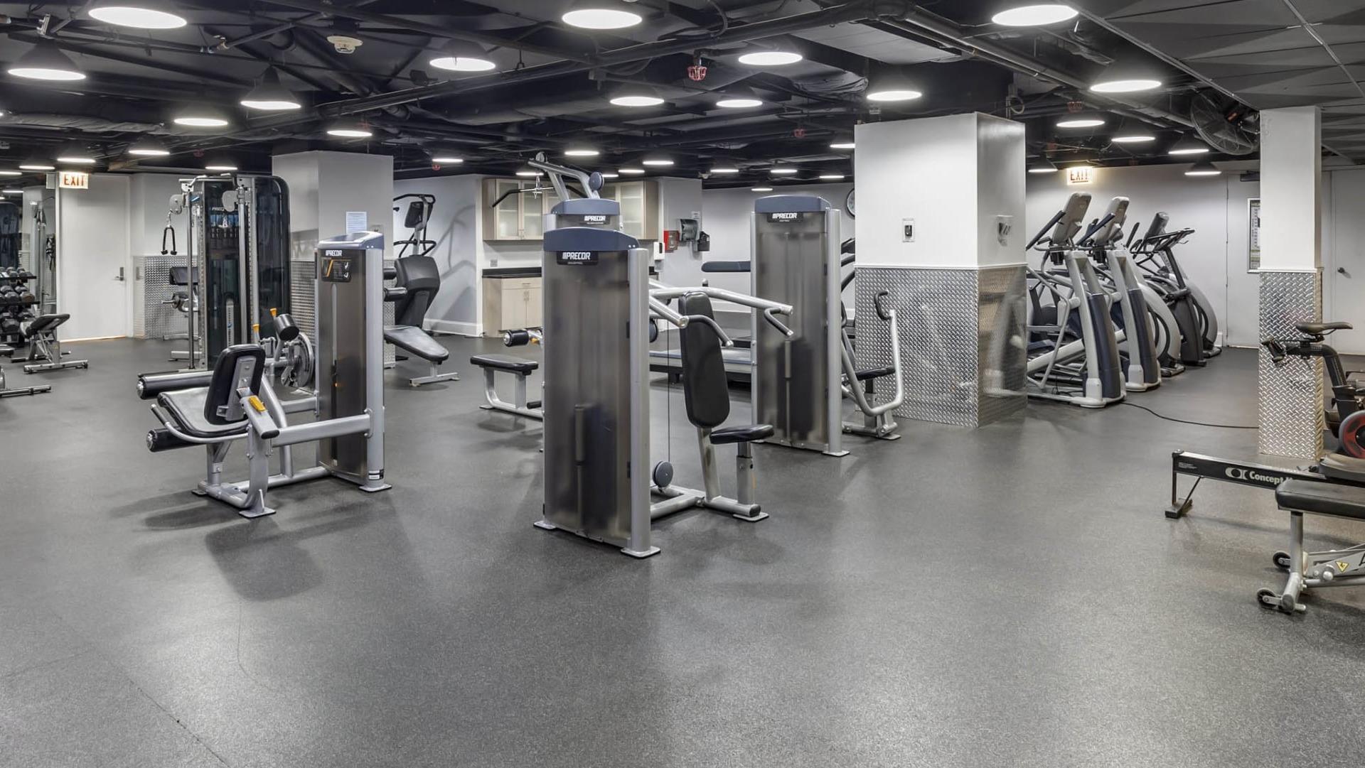 Spacious fitness center at North Harbor Tower in Chicago featuring strength machines, cardio equipment, and free weights for resident workouts