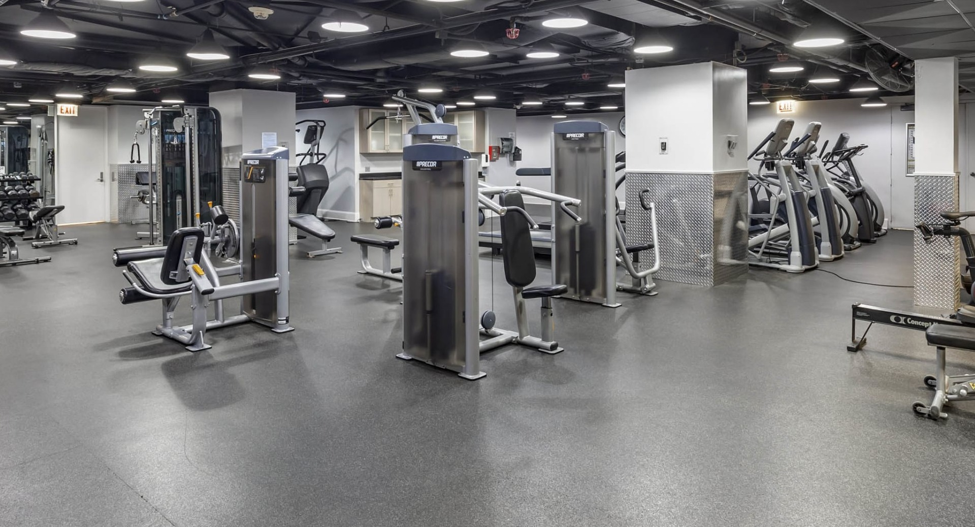 Spacious fitness center at North Harbor Tower in Chicago featuring strength machines, cardio equipment, and free weights for resident workouts