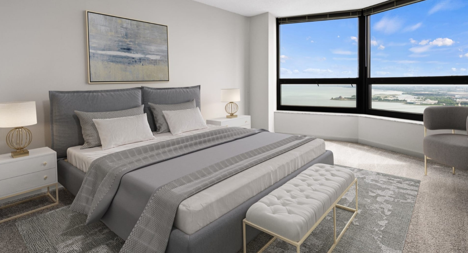 Serene primary bedroom at North Harbor Tower featuring a plush bed, neutral décor, and a wide lake and city outlook through expansive Chicago windows