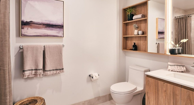 Modern bathroom with a shower-tub combination, wood vanity, stylish mirror, and functional open shelving at OLD TOWN PARK THREE in Chicago