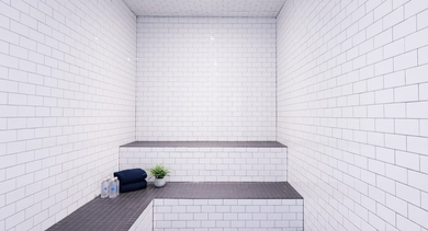 Clean and minimalist steam room with white subway tiles and multi-tiered seating, ideal for relaxation at OLD TOWN PARK THREE in Chicago