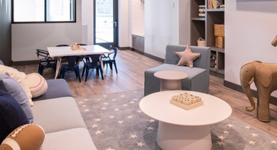 Engaging children's activity room with toys, a table for crafts, and cozy seating at OLD TOWN PARK TWO Chicago