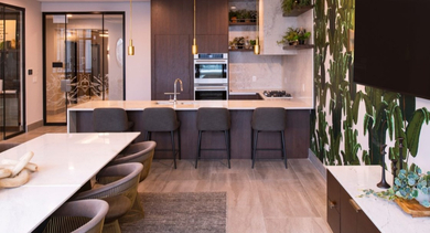 Luxurious private dining room with a large table, fully equipped kitchen, and elegant tropical wallpaper at OLD TOWN PARK TWO Chicago