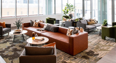 Expansive resident lounge with diverse seating arrangements and panoramic city views from large windows at OLD TOWN PARK TWO Chicago