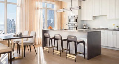 Bright apartment kitchen and dining area at One Bennett Park Apartments in Chicago, featuring contemporary design and expansive city views