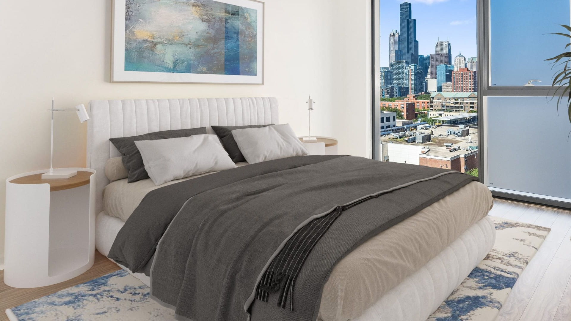 Peaceful bedroom with upholstered bed, large window and partial frosted panel, plus city views at ONE333 apartments in Chicago
