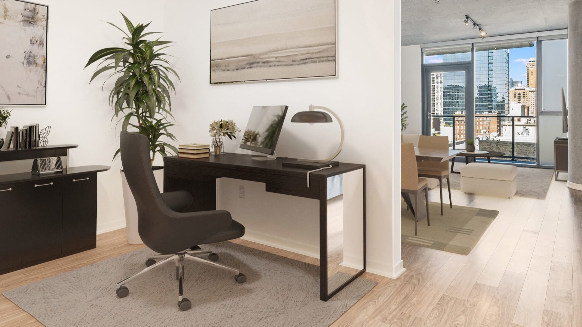 Bright home office nook with desk and storage leading to an open living area with balcony at ONE333 apartments in Chicago—ideal for remote work