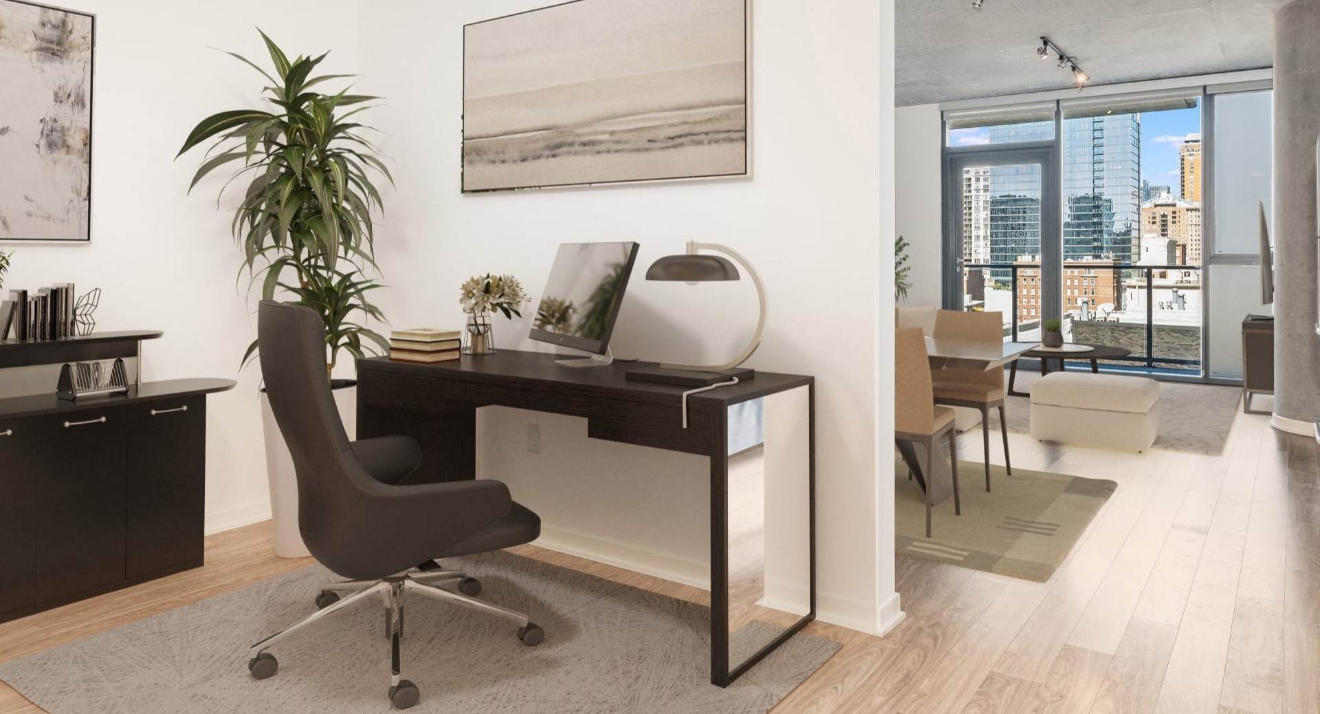 Bright home office nook with desk and storage leading to an open living area with balcony at ONE333 apartments in Chicago—ideal for remote work