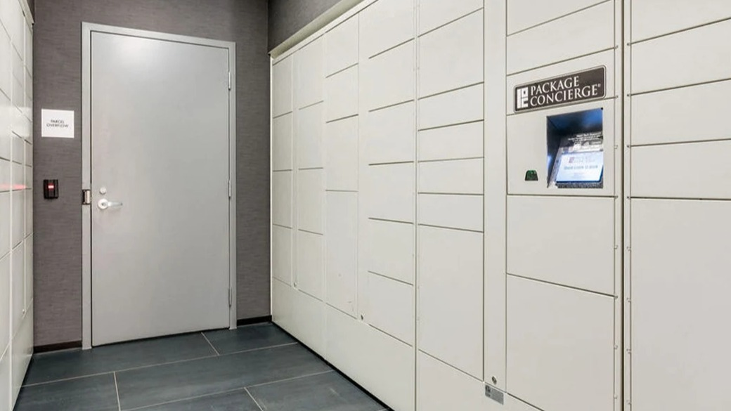 Package Concierge locker room at ONE333 apartments in Chicago providing secure, self-service parcel pickup with smart kiosk and controlled access