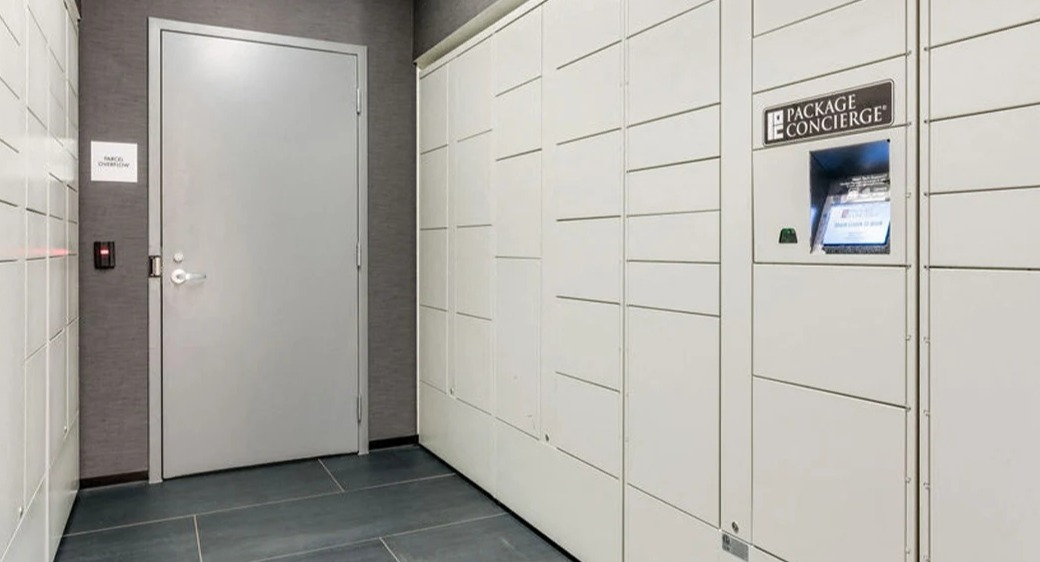 Package Concierge locker room at ONE333 apartments in Chicago providing secure, self-service parcel pickup with smart kiosk and controlled access