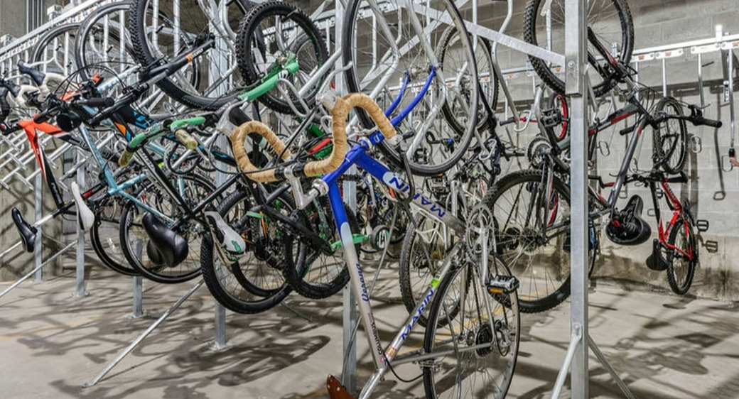 Secure indoor bike storage room at ONE333 apartments in Chicago with vertical racks and ample space for commuters and cycling enthusiasts