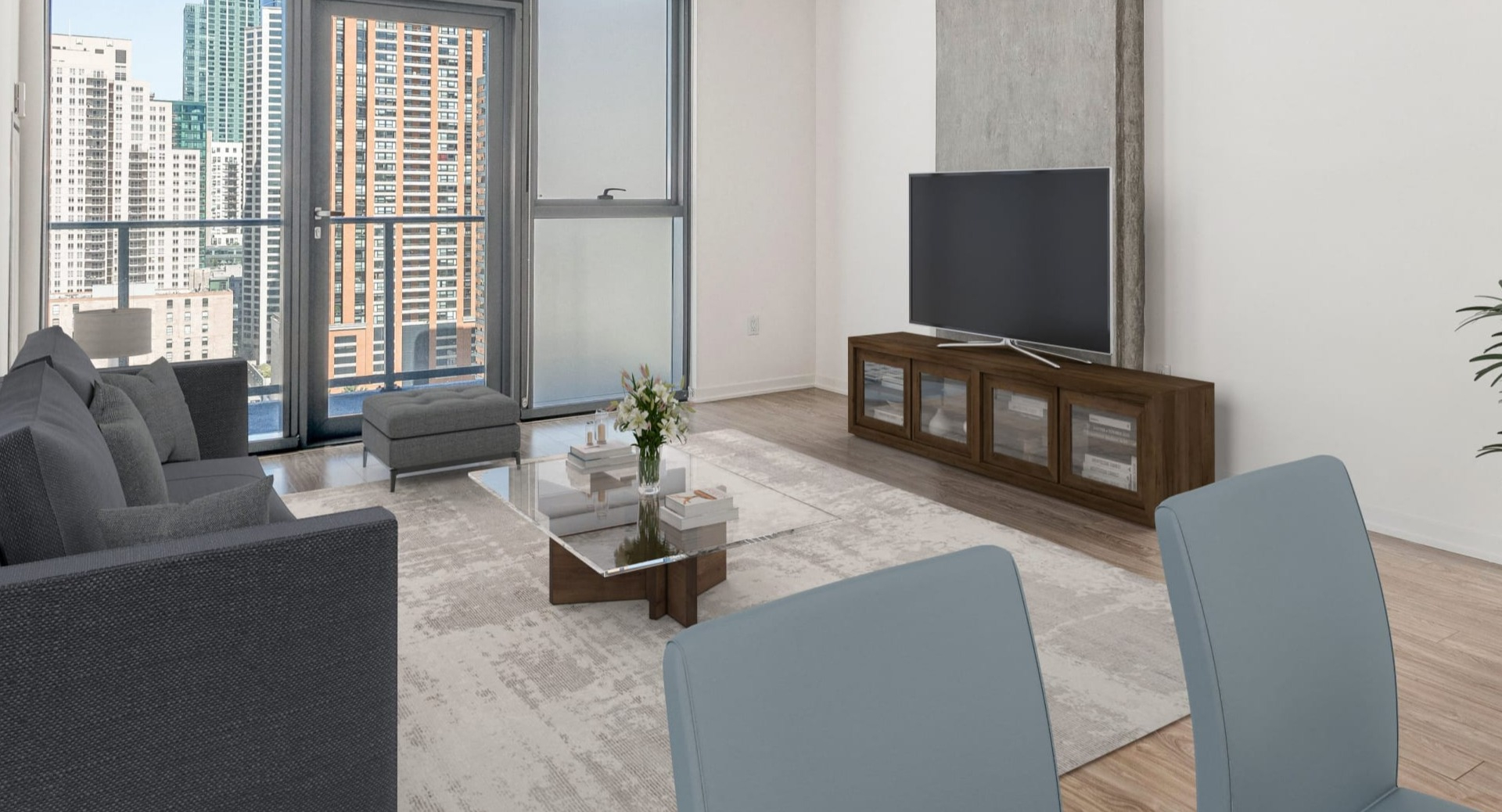 Spacious living room with track lighting, floor-to-ceiling windows, and balcony access at ONE333 apartments in Chicago, perfect for relaxing or hosting friends