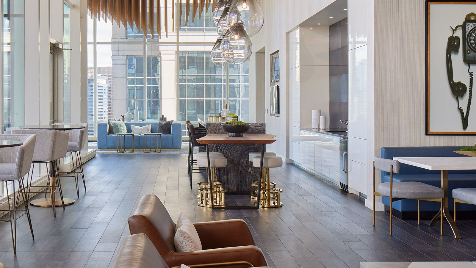 Sophisticated clubroom at OneEleven in Chicago, featuring a chic bar area, dining tables, and plush seating perfect for entertaining