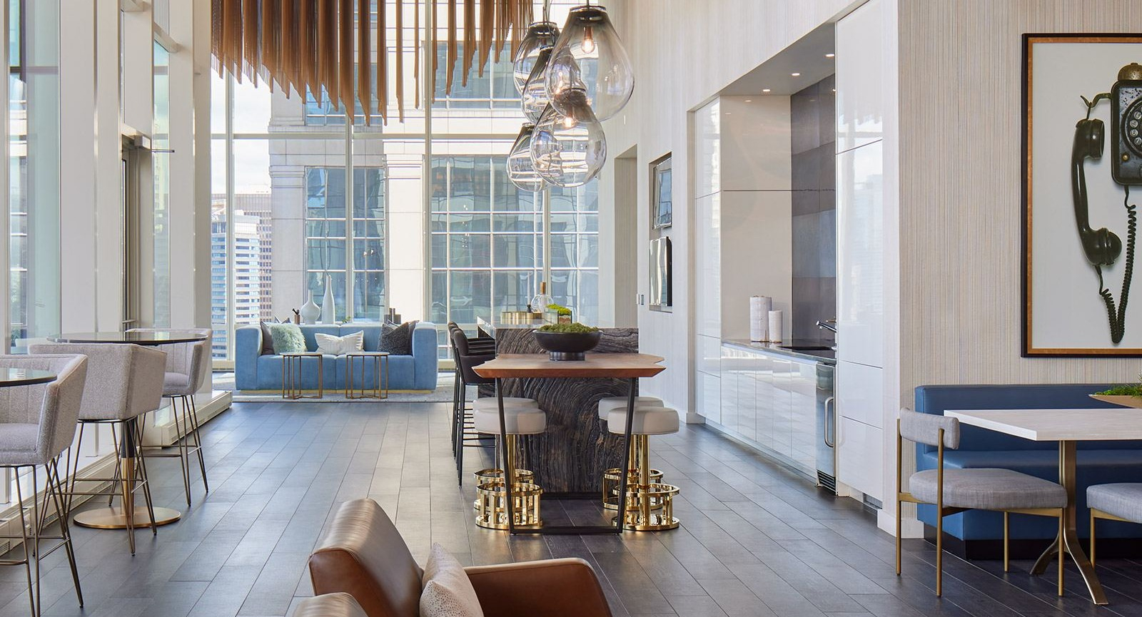 Sophisticated clubroom at OneEleven in Chicago, featuring a chic bar area, dining tables, and plush seating perfect for entertaining