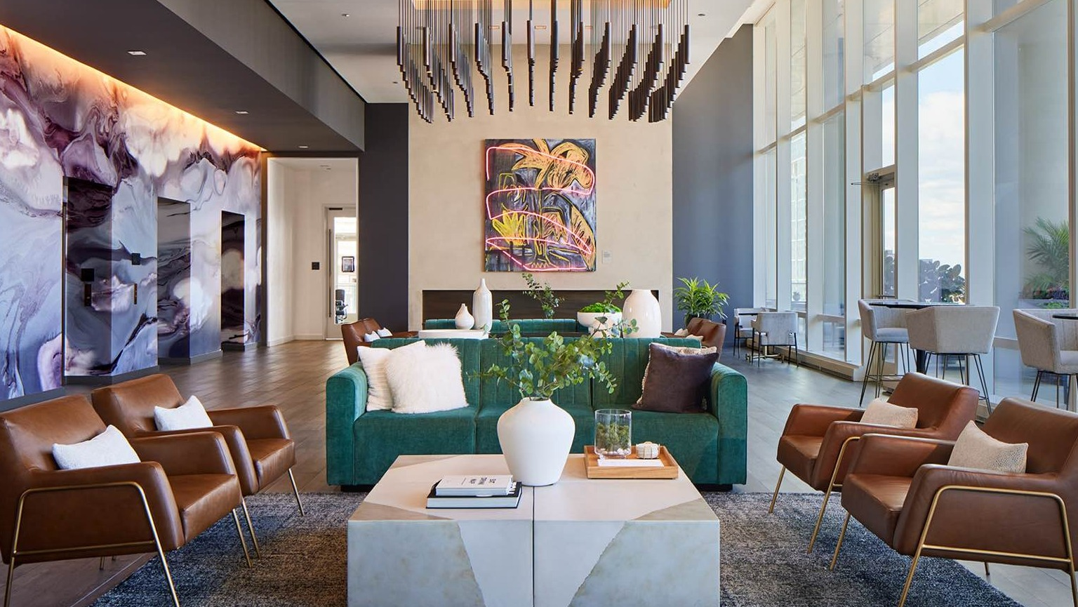 Grand lobby lounge at OneEleven in Chicago, showcasing modern art, luxurious seating, and sophisticated lighting for a chic ambiance