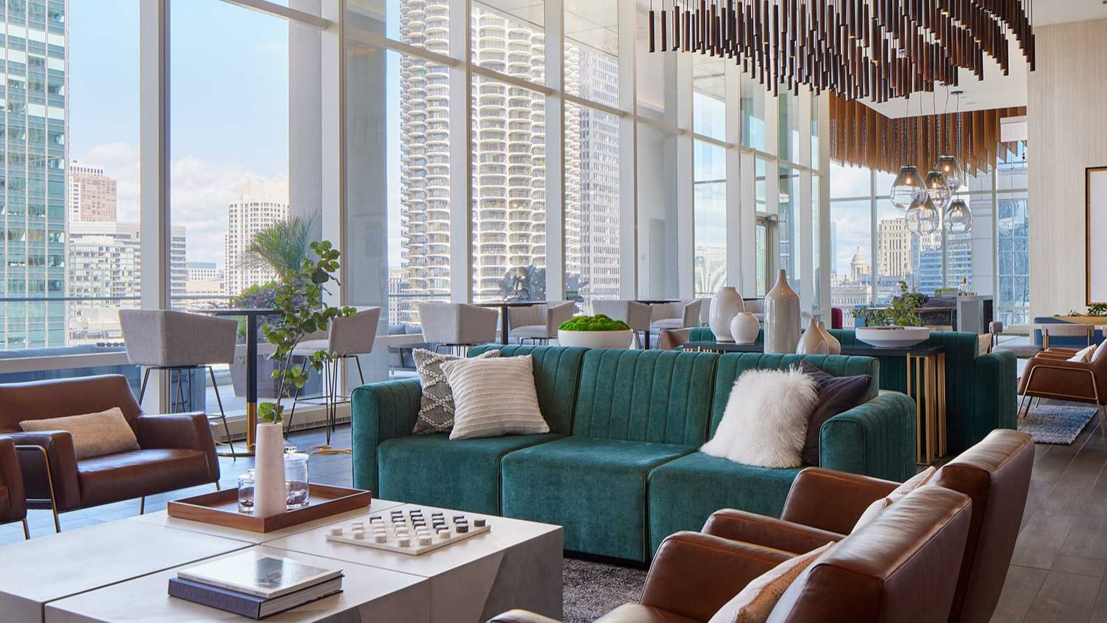 Luxurious resident lounge at OneEleven in Chicago, with stylish furniture, modern lighting, and stunning city skyline views