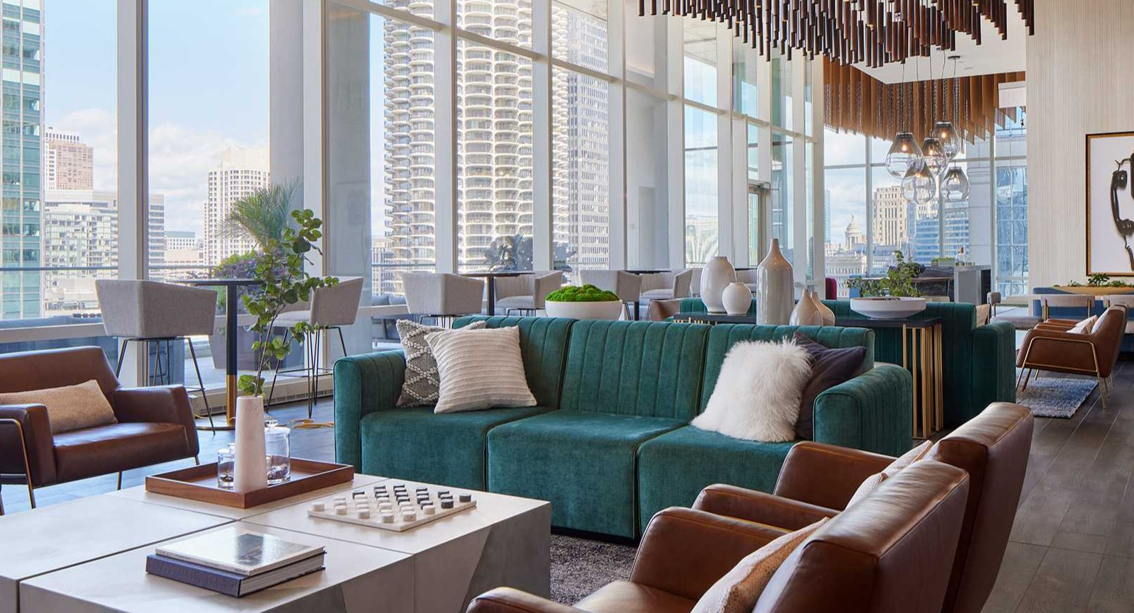 Luxurious resident lounge at OneEleven in Chicago, with stylish furniture, modern lighting, and stunning city skyline views