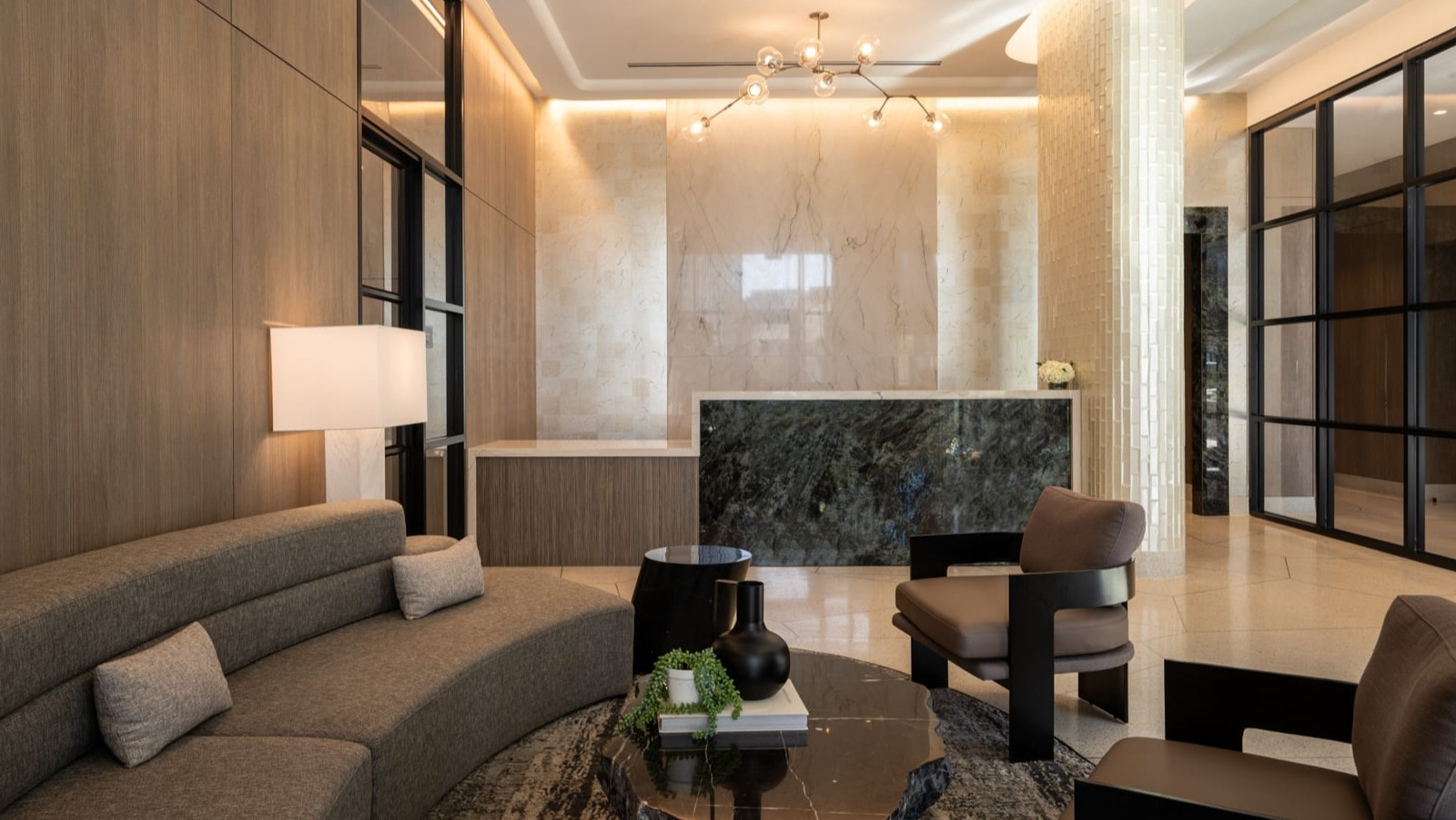 Grand lobby and reception area at Onni Fulton Market in Chicago, featuring a modern desk, elegant seating, and sophisticated finishes