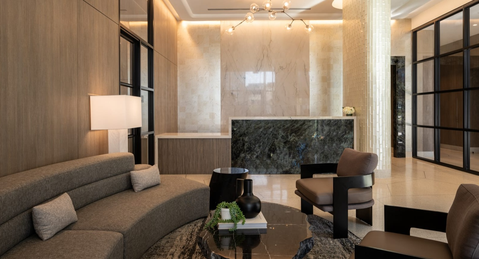 Grand lobby and reception area at Onni Fulton Market in Chicago, featuring a modern desk, elegant seating, and sophisticated finishes