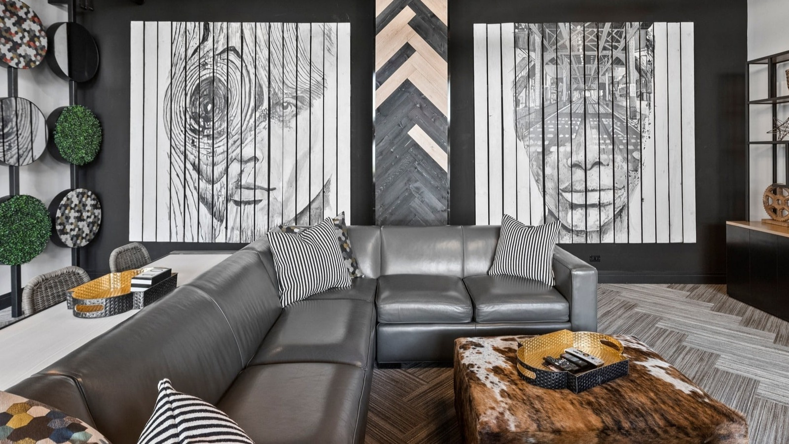 Modern clubhouse seating area at Park Michigan in Chicago, featuring comfortable sofas, stylish decor, and eye-catching wall art