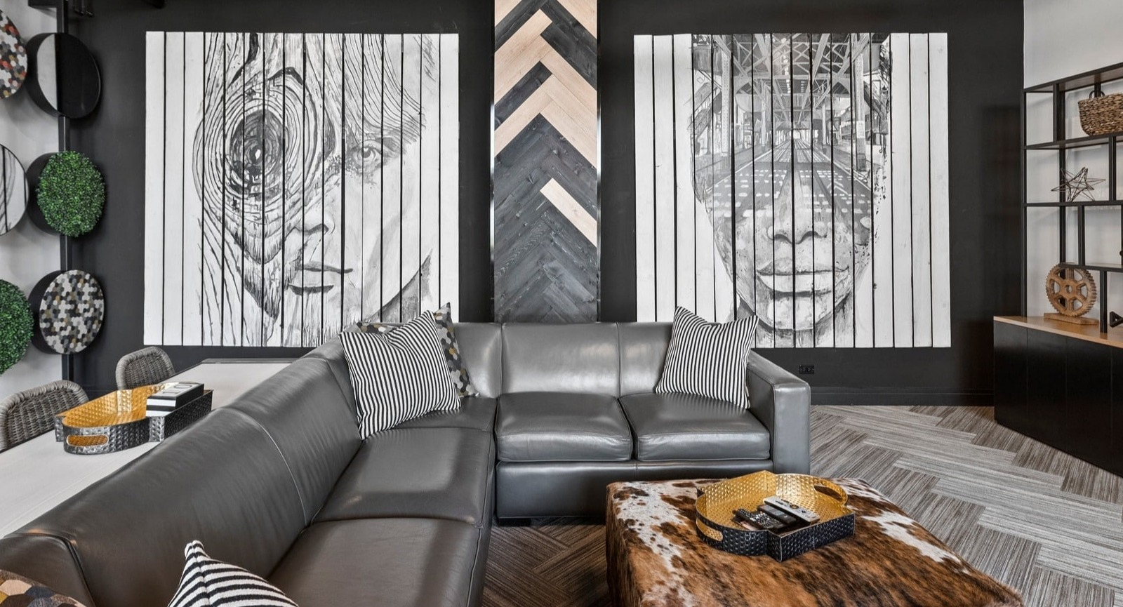 Modern clubhouse seating area at Park Michigan in Chicago, featuring comfortable sofas, stylish decor, and eye-catching wall art