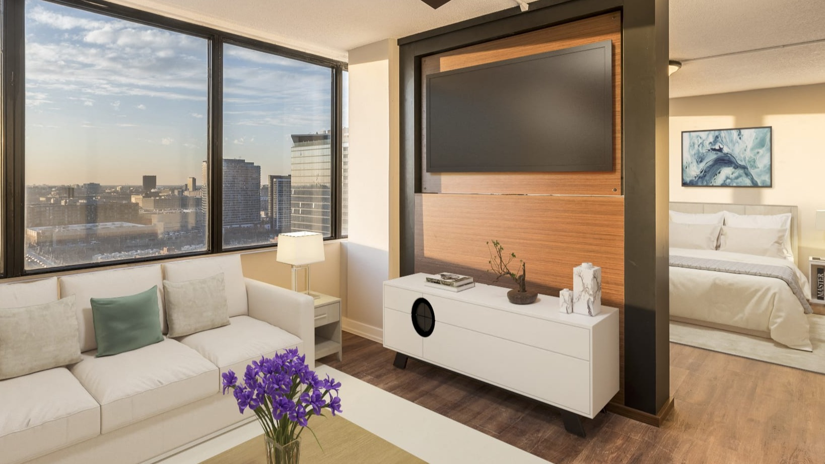 Bright studio apartment with an open layout, a living area, bedroom, and large windows offering city views at Park Michigan in Chicago