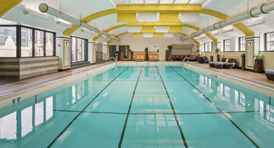 Historic and elegant indoor swimming pool at Randolph Tower City Apartments in Chicago, featuring classic architectural details