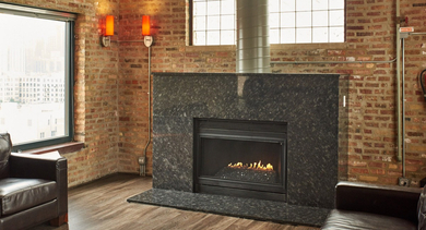 A cozy living space featuring exposed brick walls, comfortable leather sofas, and a modern fireplace, perfect for relaxing at River West Lofts in Chicago