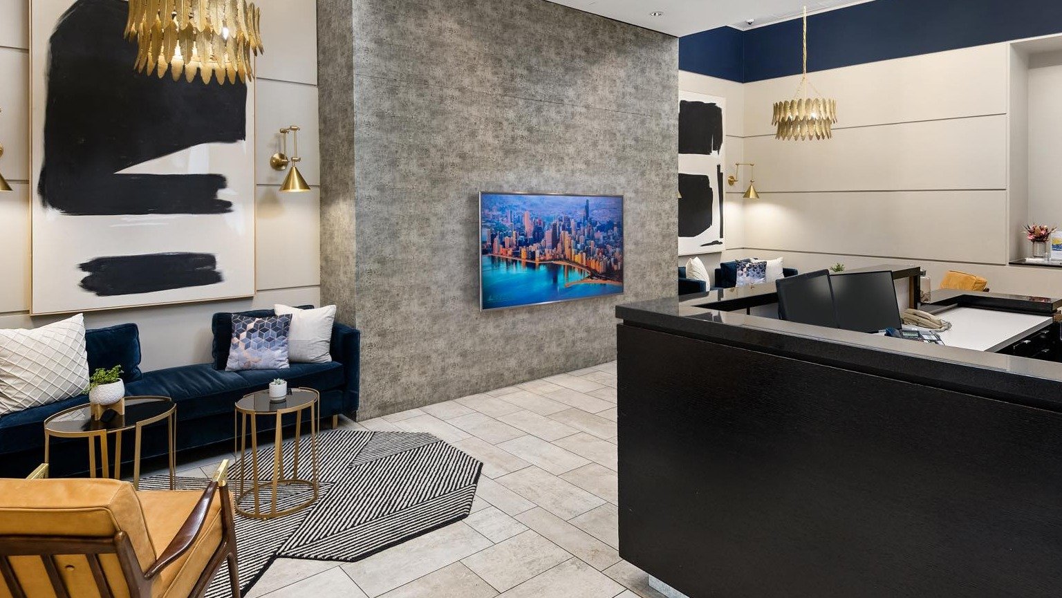 Modern and inviting lobby reception area with stylish seating, contemporary art, and a welcoming front desk at Roosevelt Collection Lofts