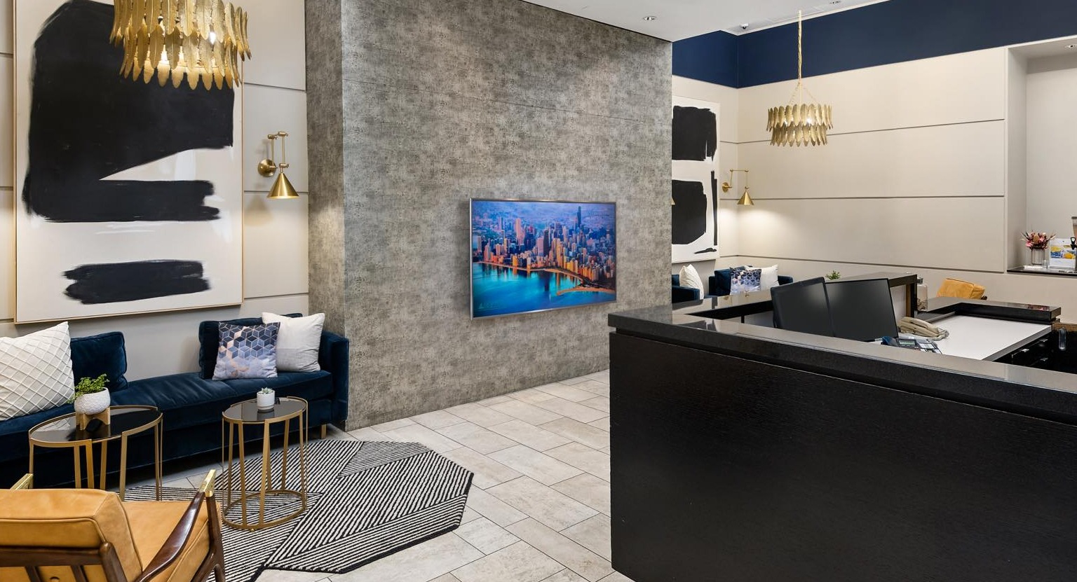 Modern and inviting lobby reception area with stylish seating, contemporary art, and a welcoming front desk at Roosevelt Collection Lofts