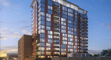Striking building exterior of Sage West Loop Apartments in Chicago at dusk, showcasing its modern architecture and illuminated windows