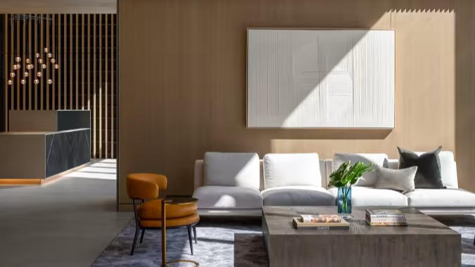 Elegant lobby lounge at Sentral Michigan Avenue in Chicago, featuring luxurious seating, warm lighting, and contemporary art