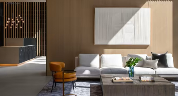 Elegant lobby lounge at Sentral Michigan Avenue in Chicago, featuring luxurious seating, warm lighting, and contemporary art