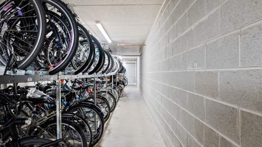Indoor bike storage room with double-decker racks at Shoreham and Tides apartments in Chicago