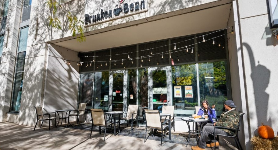 Drunken Bean coffee shop with outdoor seating located at Shoreham and Tides apartments in Chicago
