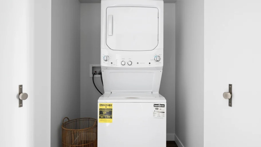 In-unit washer and dryer inside a tidy closet at Shoreham and Tides apartments in Chicago, offering everyday convenience for city renters