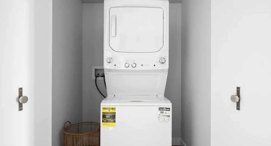 In-unit washer and dryer inside a tidy closet at Shoreham and Tides apartments in Chicago, offering everyday convenience for city renters