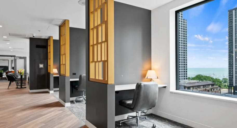 Quiet work-from-home nooks at Shoreham and Tides apartments in Chicago with built-in desks, privacy screens, and a lake view from large window