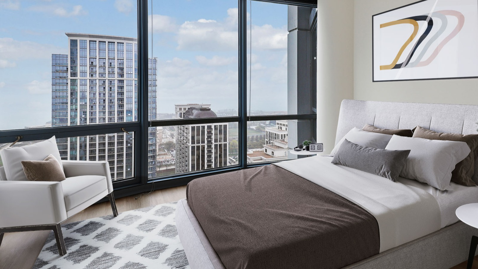 Bright bedroom at SKY55 in Chicago, featuring a cozy bed, armchair, and stunning panoramic city views through large windows