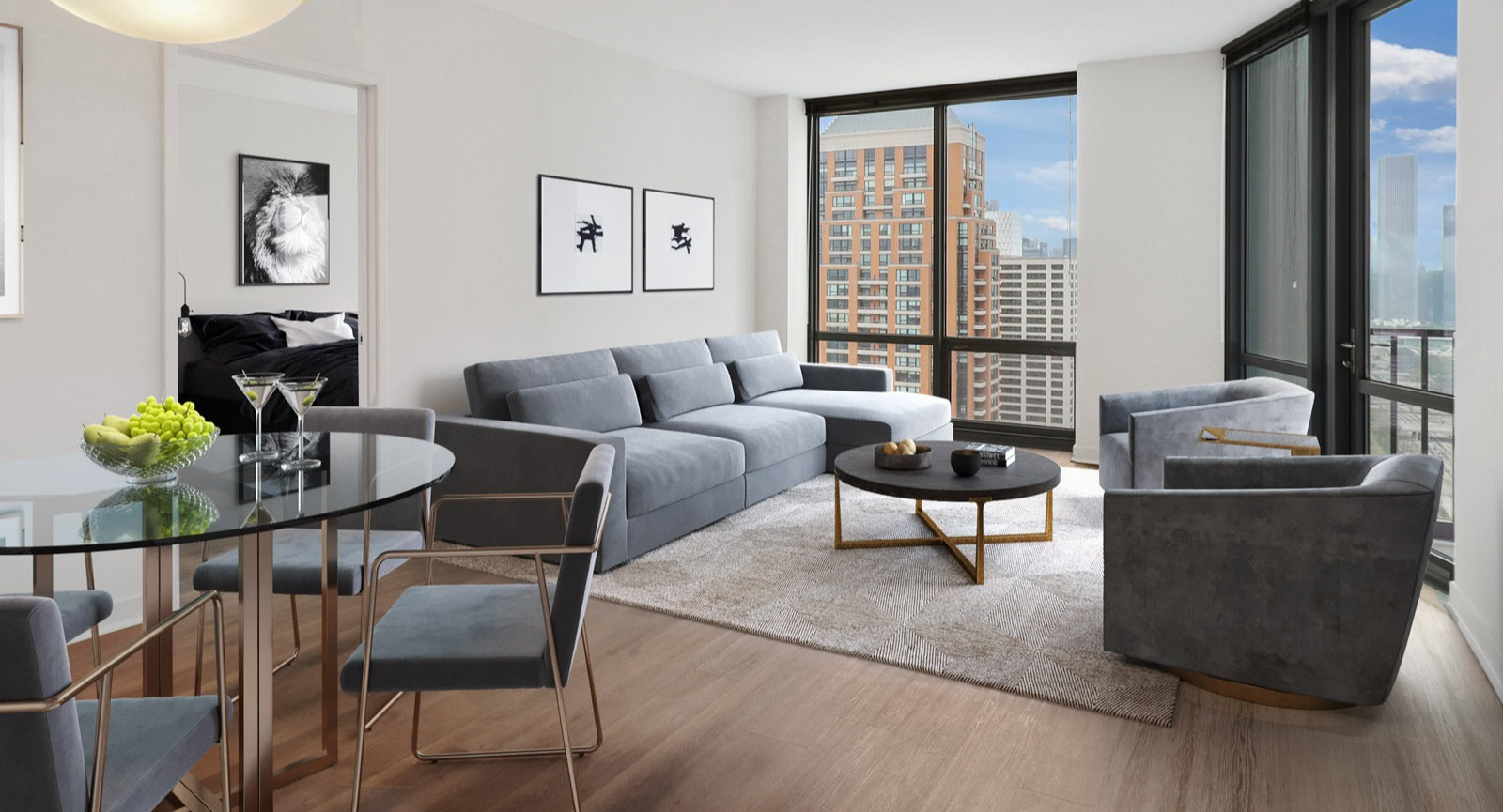 Elegant living and dining room at SKY55 in Chicago, featuring a comfortable gray sofa, glass dining table, and large windows with city views