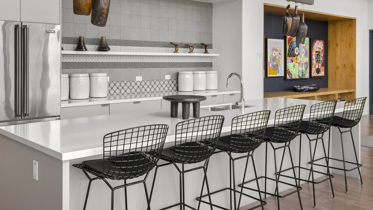A spacious communal kitchen and lounge area at Spoke Apartments in Chicago, perfect for residents to gather
