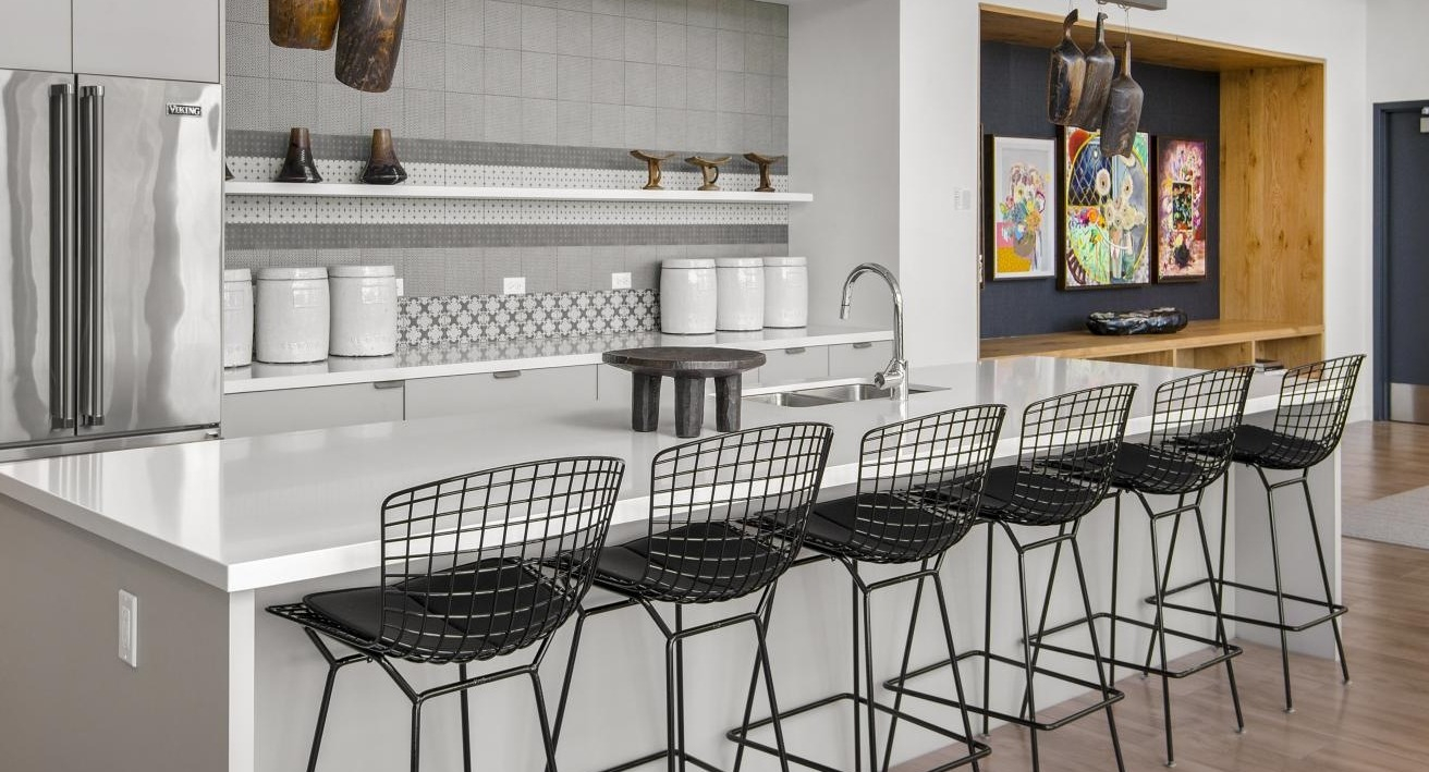 A spacious communal kitchen and lounge area at Spoke Apartments in Chicago, perfect for residents to gather